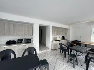 a kitchen with a table and chairs in a room at Chocolate in Ureki