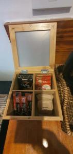 a wooden box with food and drinks in it at lala-Oh Resort in Lalao