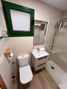 a bathroom with a toilet and a sink and a shower at CAMBARAL AS DE GUIA in Luarca +24 photos