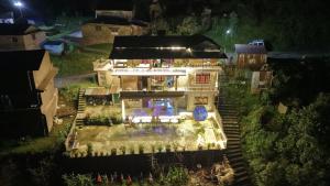 a model of a house at night at The Hotel Orchid & Restaurant in Kāskī