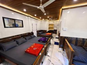 a living room with a couch and a table at Misty valley Private Pool Villa Munnar in Anachal