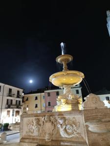a fountain with a bird sitting on top of it at Cavour 92 in Alatri