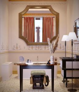 a bathroom with a sink and a mirror at Eight Venezia in Venice +46 photos