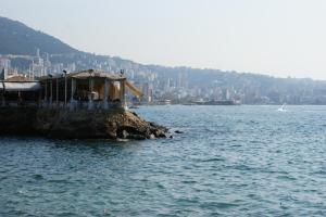 a small island in the middle of a body of water at Manuella Hotel in Ed Dkârîne