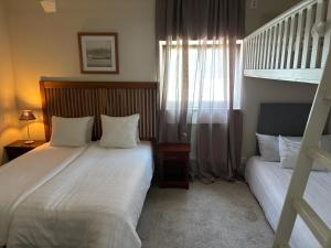 a bedroom with two beds and a bunk bed at Köpingebro in Köpingebro +54 photos