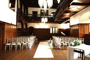 a room filled with tables and chairs in a building at Dalston Hall in Carlisle