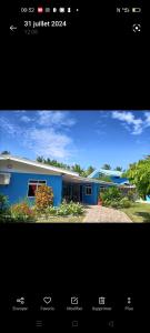 a picture of a blue building with a building at Terai vahine lodge in Rangiroa
