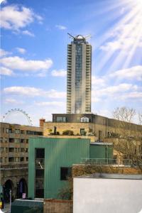 a tall building in the background of a city at Veronika Double Room in London +3 photos