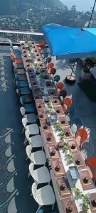 a long line of chairs and tables on a roof at Gấu Home Tây's in Tam Ðảo