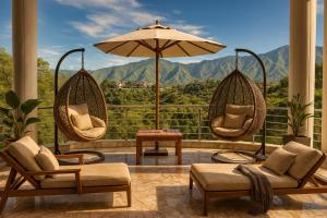 a living room with two chairs and an umbrella at The Four Season Resort, Mussoorie - top rated & most awarded property in mussoorie in Mussoorie
