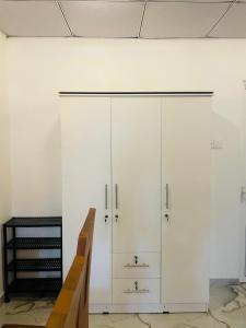 a large white cabinet in a room at Coastal Bliss in Dickwella