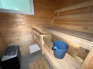 a inside of a sauna with a bucket in it at Ravikatu, Oulainen, in Oulainen