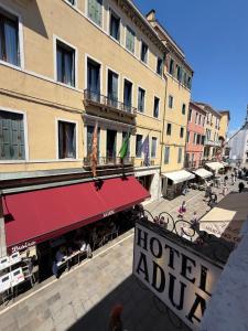 a hotel audit sign in front of a building at Hotel Adua in Venice