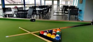 a pool table with cue balls in the middle at Delta Palace in Sulina