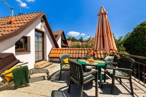 a patio with a table and an umbrella at Jaroslav Ambrož Elvomont Chlum u Třeboně in Chlum u Třeboně