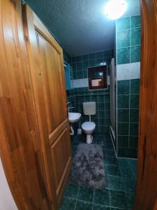 a bathroom with a toilet and a sink at slavko in Šipovo