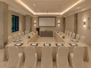 a large meeting room with a long table and chairs at Hotel ZP Grand in Bhilai