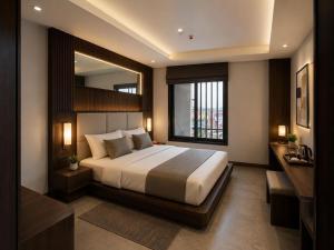 a bedroom with a large bed and a large mirror at Hotel ZP Grand in Bhilai