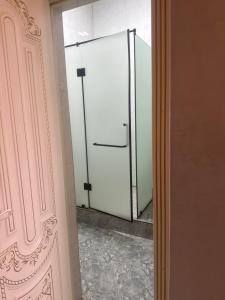 a sliding glass door in a room at Rodnik in Almaty