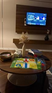 a coffee table with a tv on a wall at شقة غرفة وصالة مريحة in Jeddah +5 photos