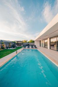 a swimming pool in the backyard of a house at BALİ Sapanca in Sapanca