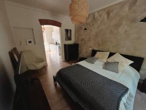 a bedroom with a bed and a living room at Portside studio, free parking, self check-in in Klaipėda