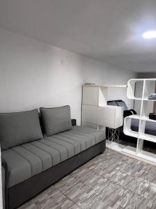 a living room with a couch and a bunk bed at REBL Suites in Sutješčica