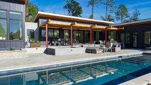 a house with a swimming pool and a patio at Olive Oak by AvantStay in Glen Ellen