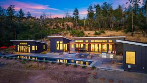 a house with a pool in front of it at Olive Oak by AvantStay in Glen Ellen