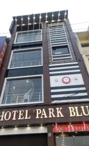 a building with a hotel park blue sign in front of it at Hotel Park Blu in Pānīpat +3 photos