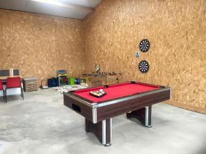 a room with a pool table in a room at Pencaerau Pods - Enlli Pod in Pwllheli +6 photos