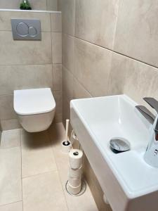 a bathroom with a toilet and a sink at Apartamento Aliciamin in Costa Calma +37 photos