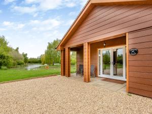 a house with a patio with a view of a river at Swallow - Uk41035 in Marston