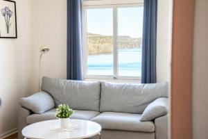a living room with a couch and a table at B&B Carl XII in Ed