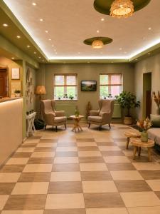 a waiting room at a hospital with chairs and tables at Hotel Olimp in Cluj-Napoca +24 photos