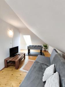 a living room with a couch and a table at Apartman Glacier in Tatranska Strba