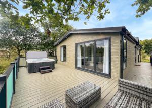 a large deck with a couch and a grill at Bowland Escapes in Chipping +57 photos