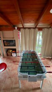 a pool table in a living room with avertisementvertisement at Montecielo in San Antonio de Arredondo