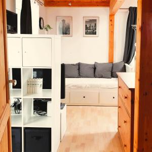 a small room with a bed in a tiny house at FeWo Mangfall in Bruckmühl +19 photos