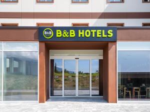 a building with a bbc hotel sign on it at B&B HOTEL Ascoli Piceno in Ascoli Piceno