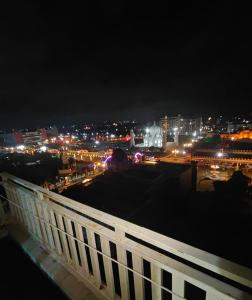 a view of a city at night with lights at Aura Vista in Bhopal