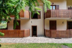 a building with balconies on the side of it at Dolomiti Apartment Pinzolo in Pinzolo