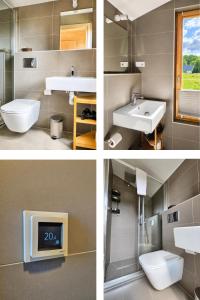 ein Badezimmer mit Waschbecken, Toilette und Fernseher in der Unterkunft 308-Tiny House Inn in Bleckede