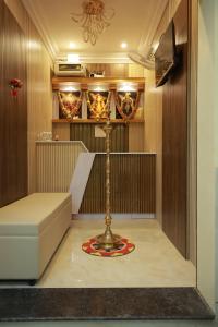 a room with a lamp in the middle of a room at Sri Balakrishna Residency in Thiruchendur