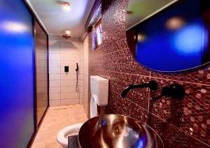 a bathroom with a sink and a toilet and a mirror at Sea View Premium in Costinesti +11 photos