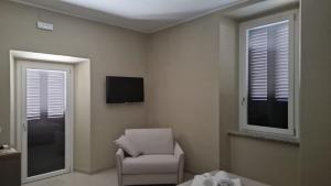 a living room with a chair and a television at Villa Casinelli B&B in Isola del Liri +25 photos