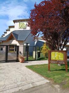 a sign in front of a building at Esquel Apart Loft in Esquel +11 photos