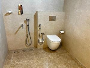 a bathroom with a toilet and a shower at Haritham Heritage Villa in Vadakkāncheri +34 photos