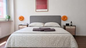 a bedroom with a bed with two pillows on it at Central Studio Apartment with free BaselCard - Magritte in Basel