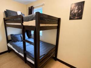 a couple of bunk beds in a room at Fantasia House General Santos in Lagao II